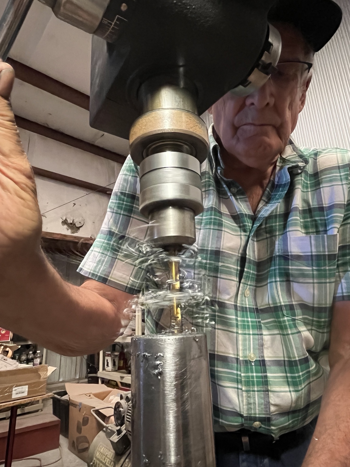 John K. Kalua machining a metal component